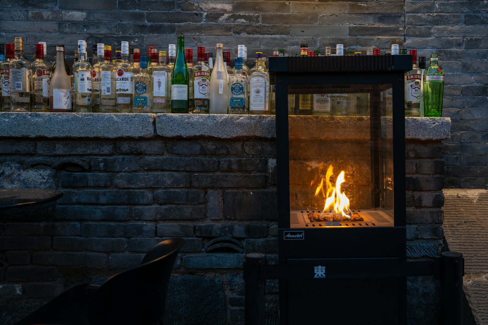 Stone fireplace with a fire burning
